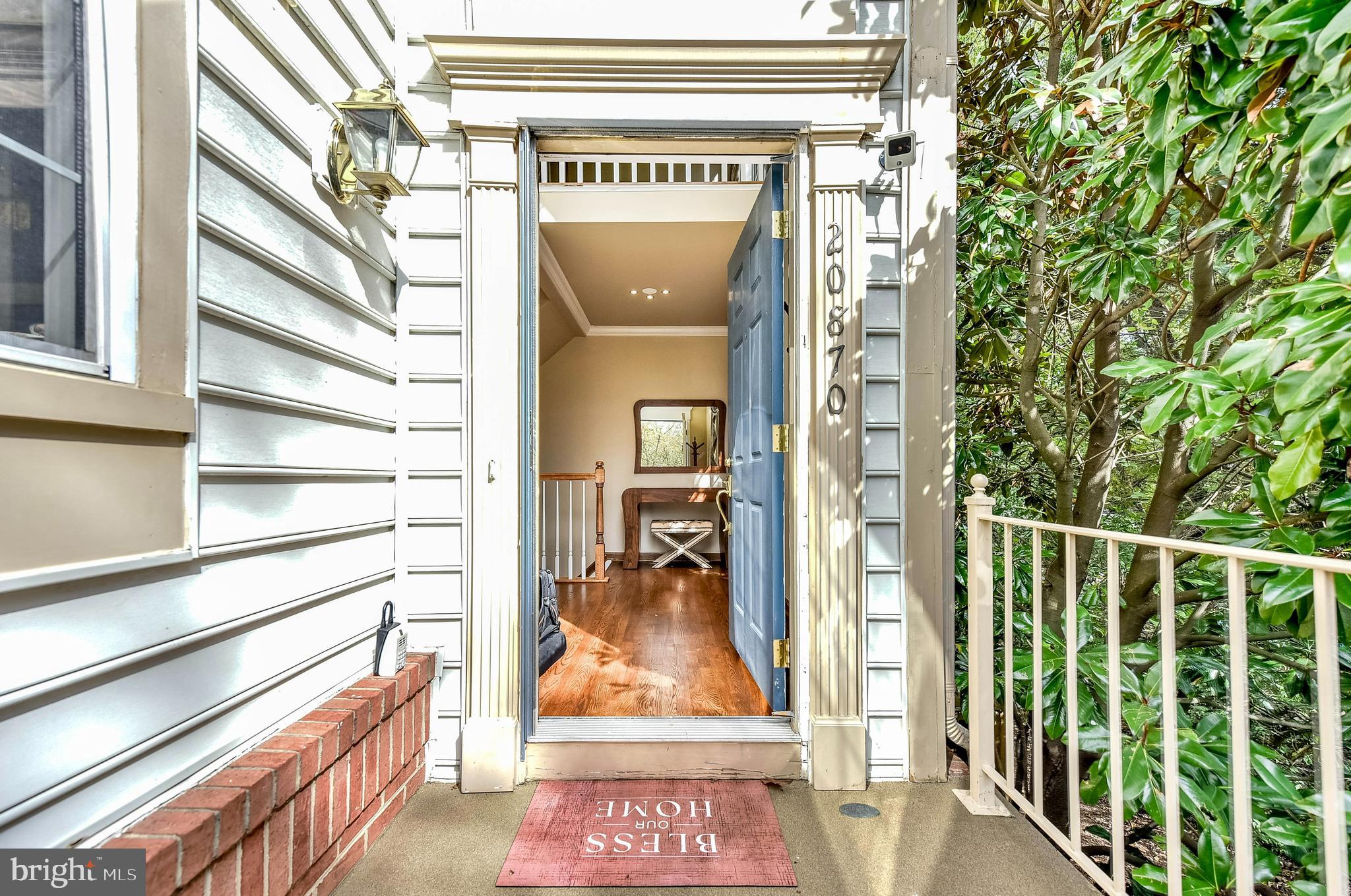20870 Trinity Square Sterling, VA 20165 - Photo 35 of 36 FRONT DOOR - STORM DOOR BEING INSTALLED