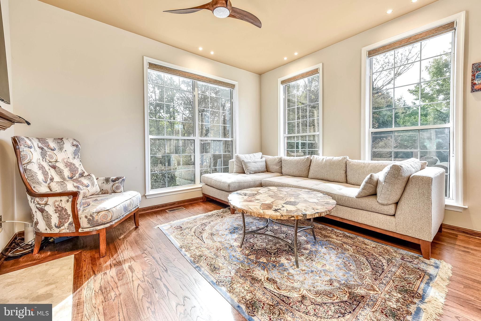 20870 Trinity Square Sterling, VA 20165 - Photo 8 of 36 SITTING AREA OFF KITCHEN WITH GAS FIREPLACE