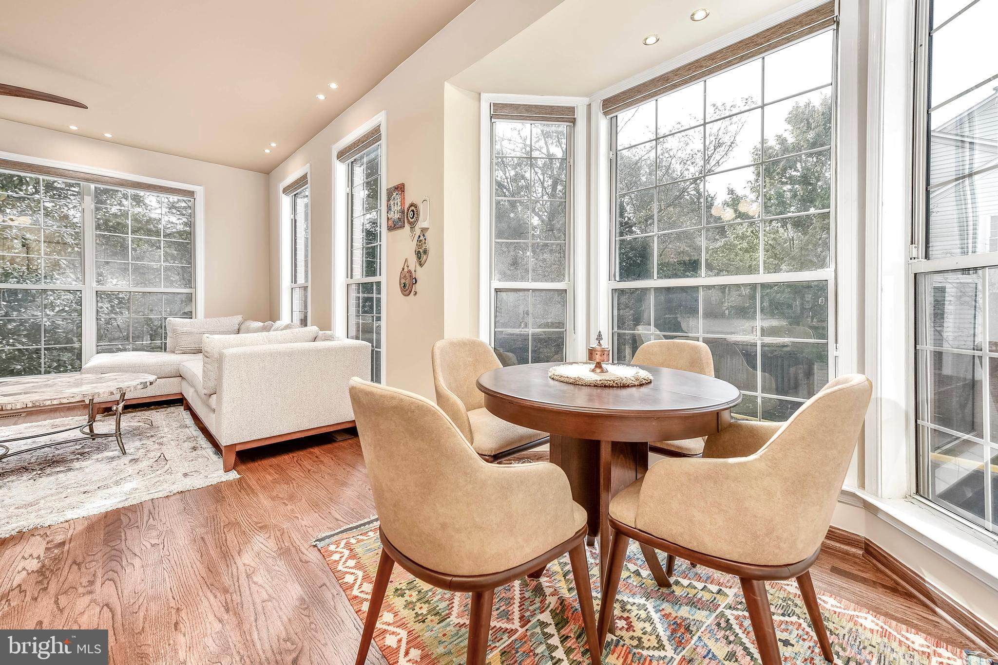 20870 Trinity Square Sterling, VA 20165 - Photo 9 of 36 KITCHEN TABLE NOOK WITH WALL OF WINDOWS