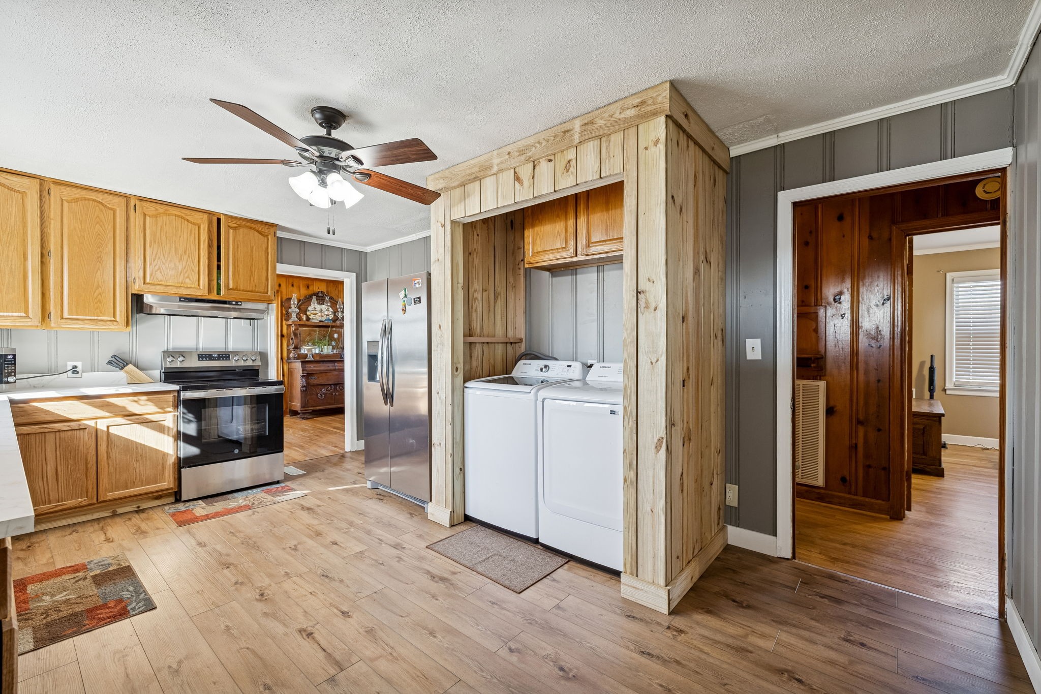 155 West Piney Road Dickson, TN 37055 - Photo 18 of 45 a kitchen with a refrigerator a sink and dishwasher with wooden floor