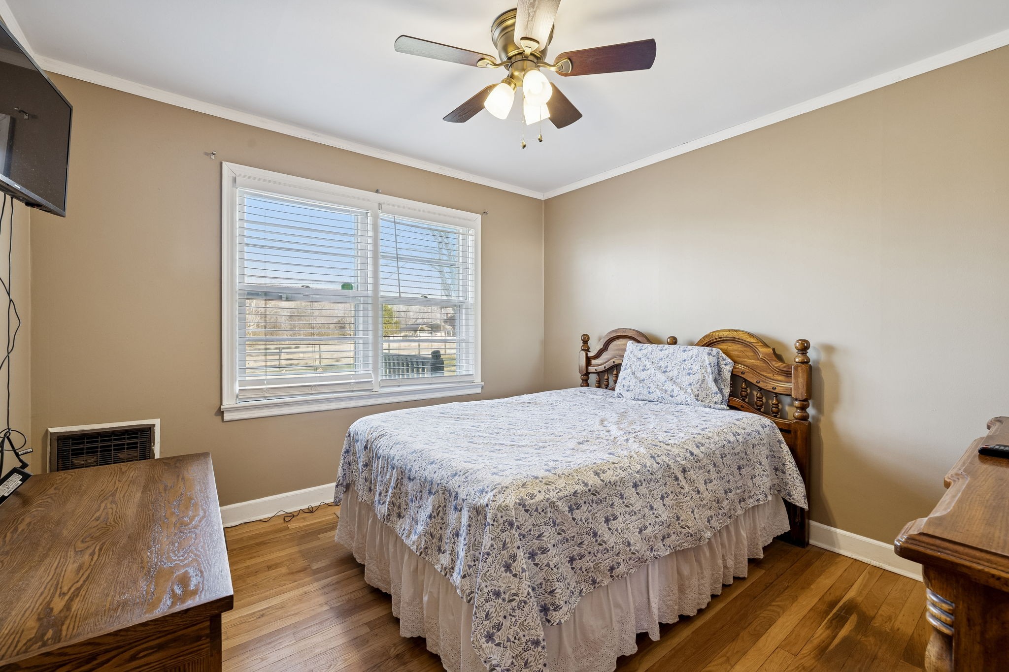 155 West Piney Road Dickson, TN 37055 - Photo 22 of 45 a bedroom with a bed and wooden floor