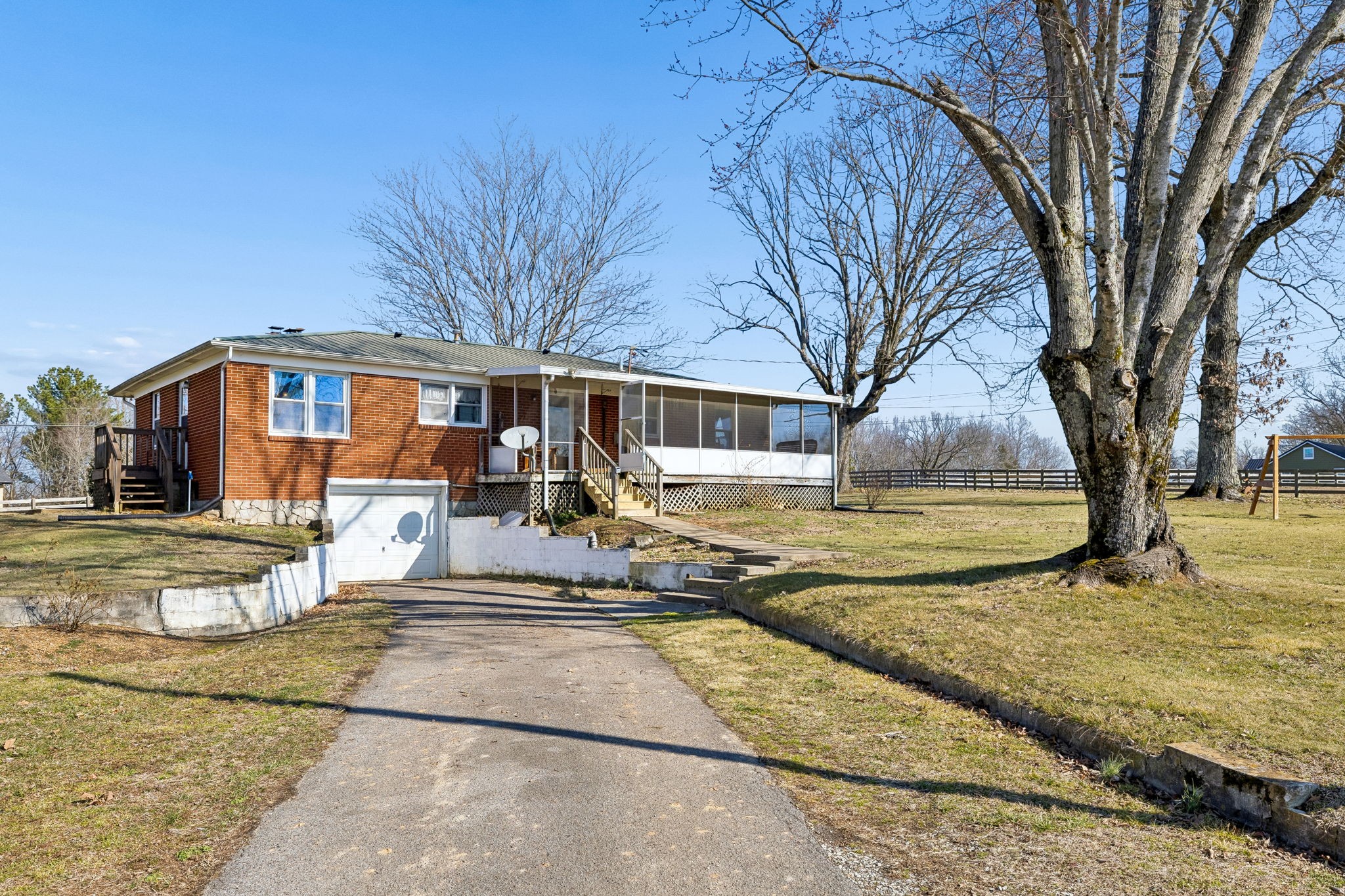 155 West Piney Road Dickson, TN 37055 - Photo 25 of 45 a view of a white house with a large tree