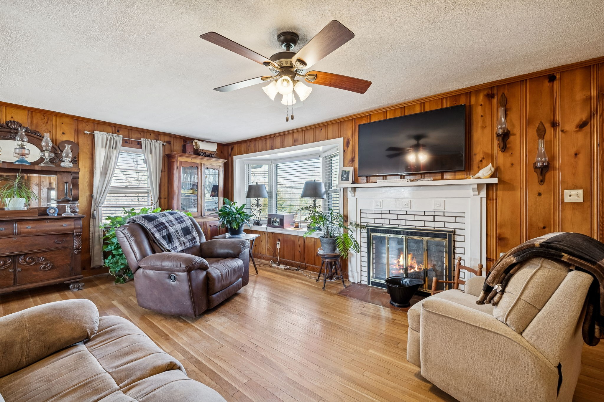 155 West Piney Road Dickson, TN 37055 - Photo 9 of 45 a living room with furniture a flat screen tv and a fireplace