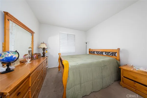 a bed room with a bed and a couch