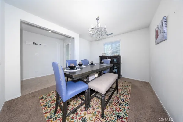 a workspace with furniture and chandelier