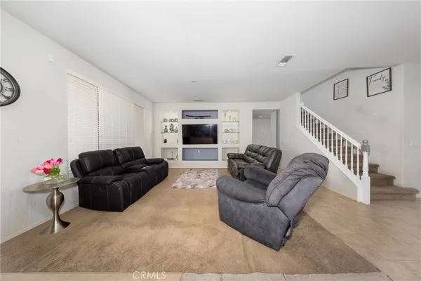 a living room with furniture and a couch