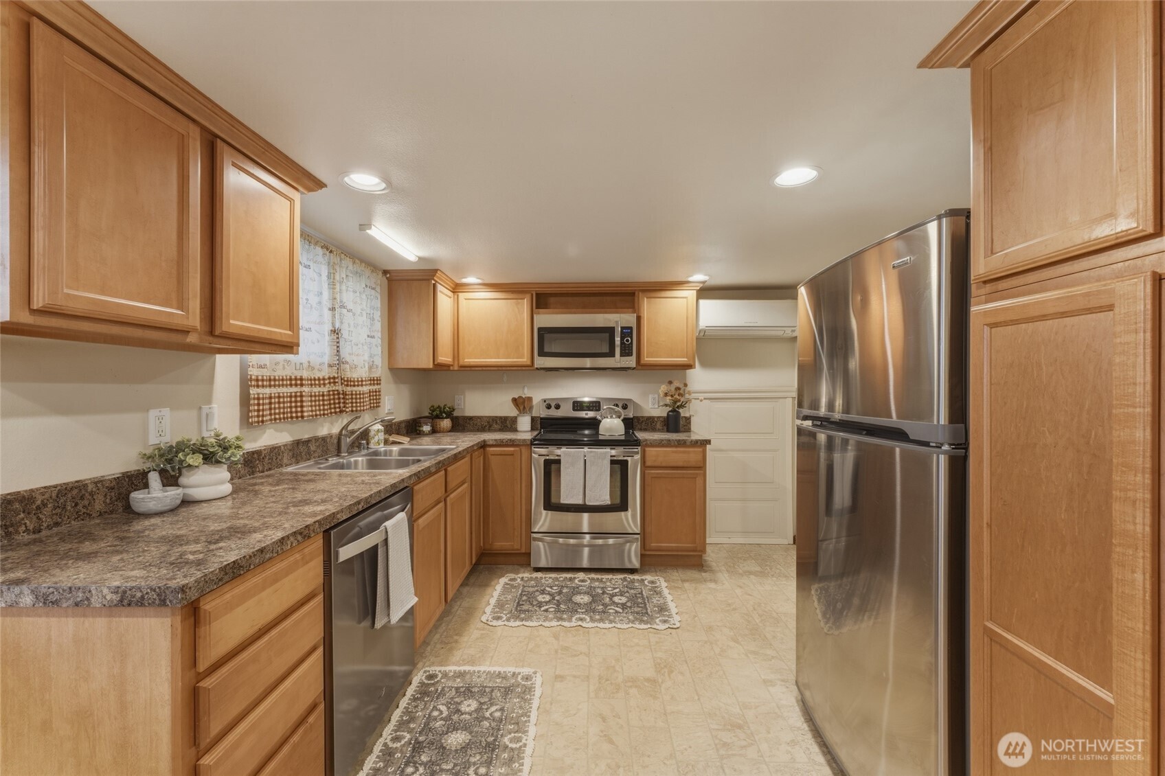 15 Southwest 13th Street College Place, WA 99324 - Photo 28 of 36 a kitchen with a refrigerator sink and cabinets