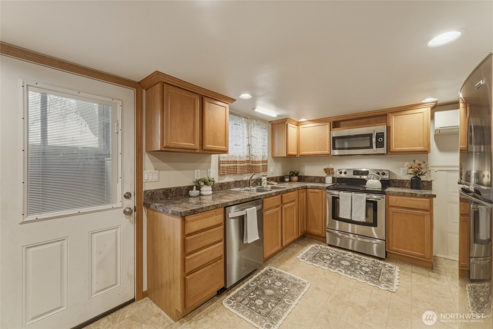 15 Southwest 13th Street College Place, WA 99324 - Photo 29 of 36 a kitchen with stainless steel appliances granite countertop a stove a sink and a refrigerator