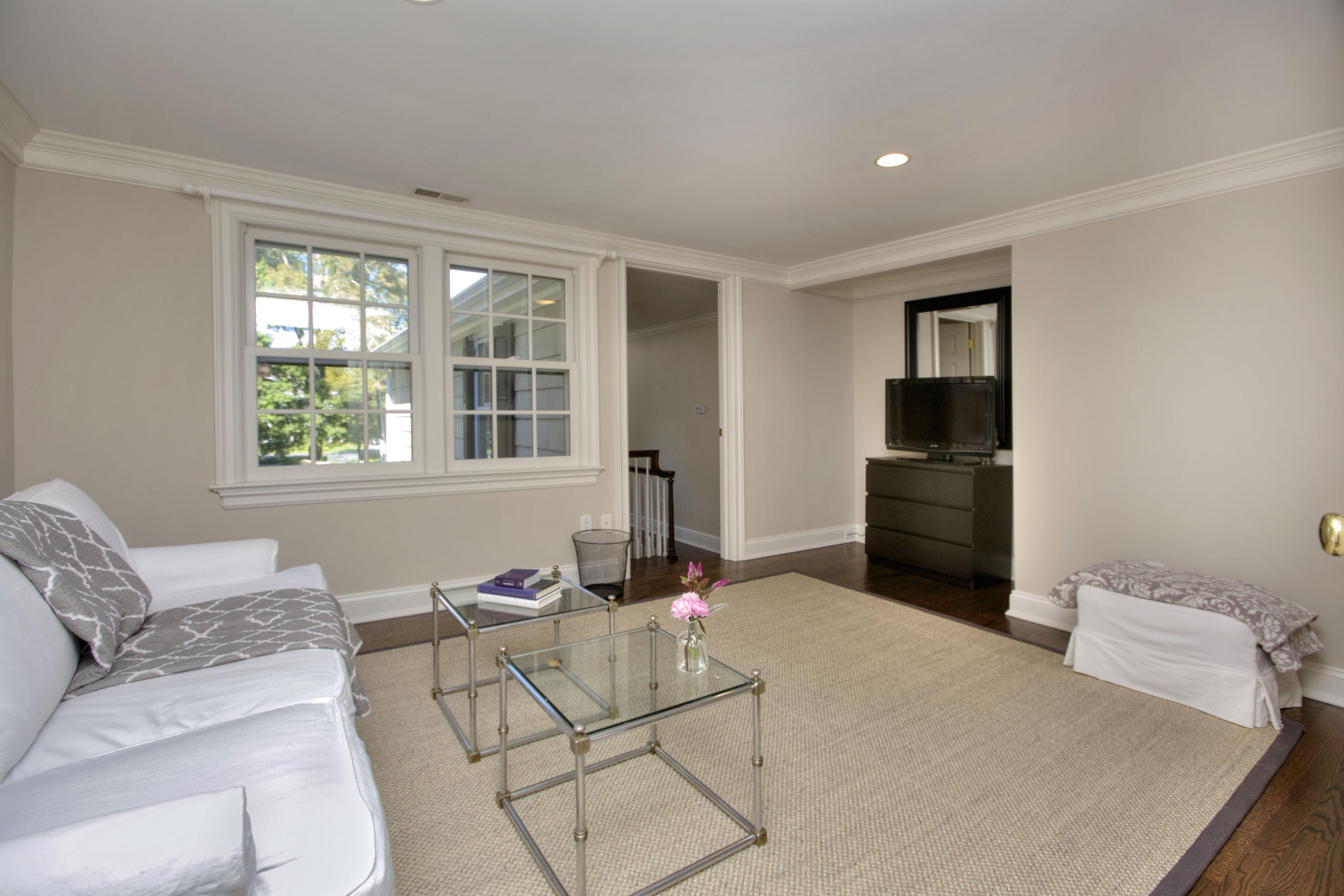 4 St Nicholas Road Darien, CT 06820 - Photo 15 of 15 a living room with furniture a rug and a window