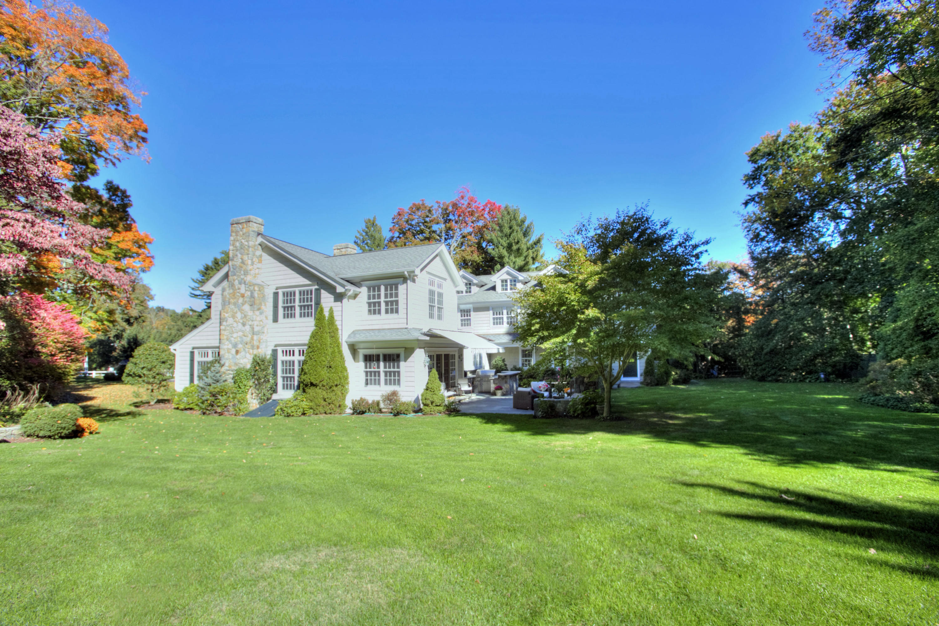 4 St Nicholas Road Darien, CT 06820 - Photo 2 of 15 a front view of a house with a yard