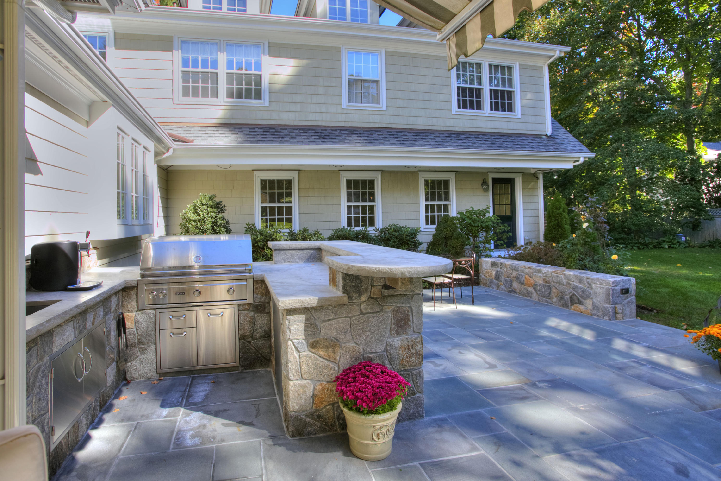 4 St Nicholas Road Darien, CT 06820 - Photo 4 of 15 a view of a house with backyard sitting area and garden