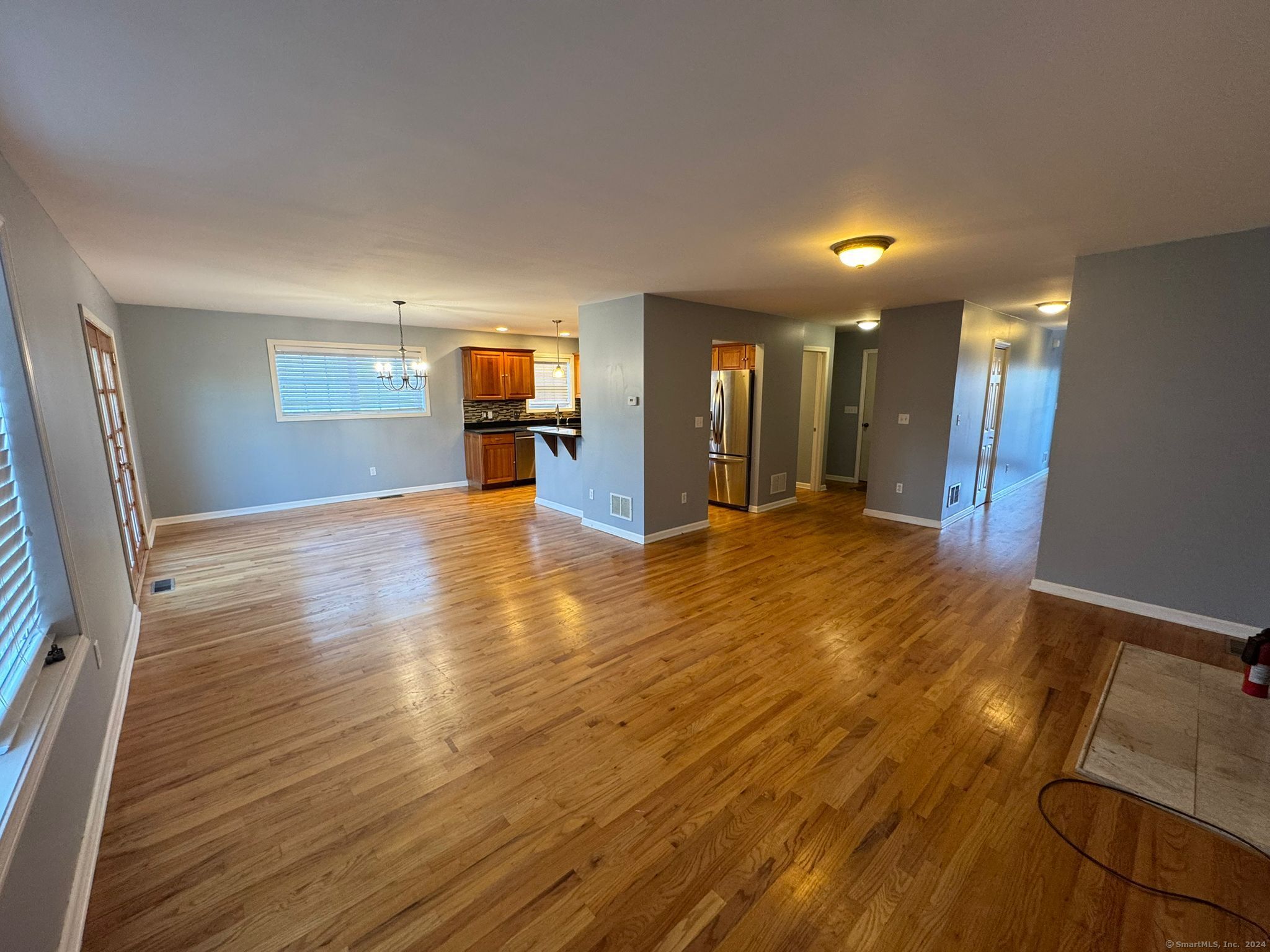 59 Gilbert Lane Branford, CT 06405 - Photo 17 of 40 a view of a livingroom with wooden floor