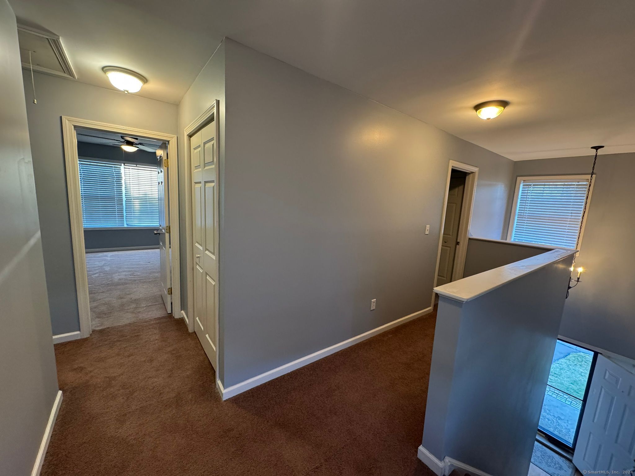 59 Gilbert Lane Branford, CT 06405 - Photo 20 of 40 an empty room with wooden floor and windows