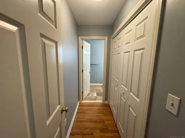 a view of a bathroom from the hallway
