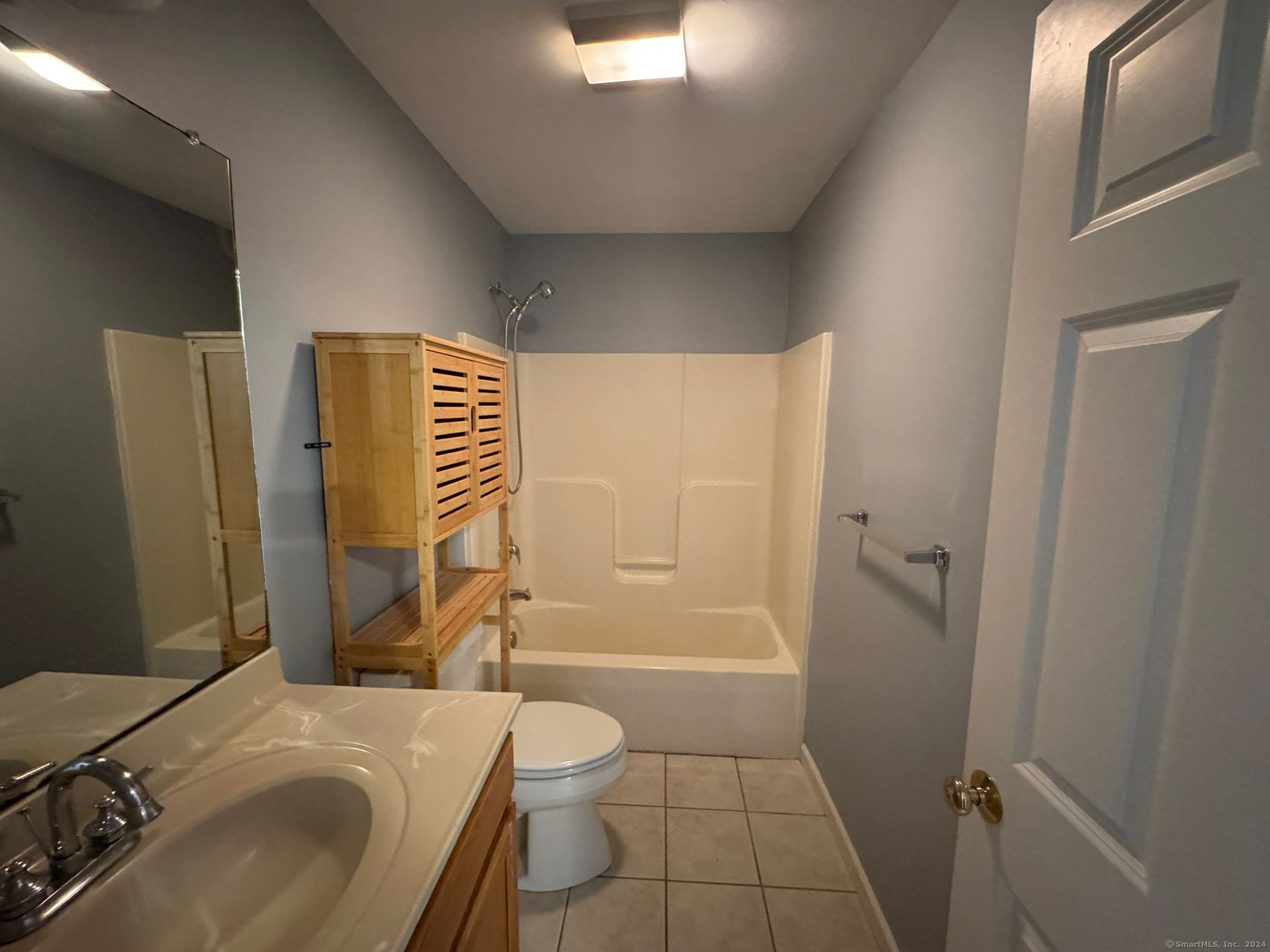 59 Gilbert Lane Branford, CT 06405 - Photo 26 of 40 a bathroom with a sink toilet and shower