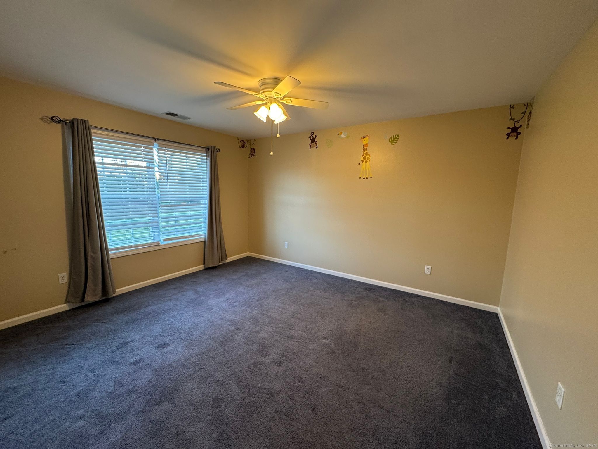 59 Gilbert Lane Branford, CT 06405 - Photo 28 of 40 a view of an empty room with a window
