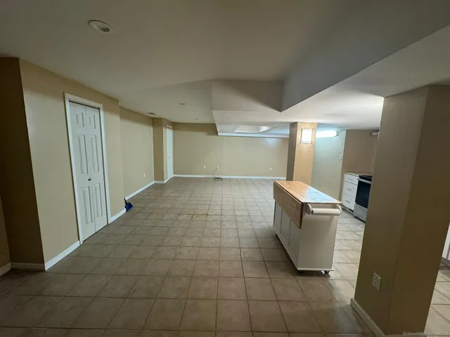 a large kitchen with cabinets and stainless steel appliances