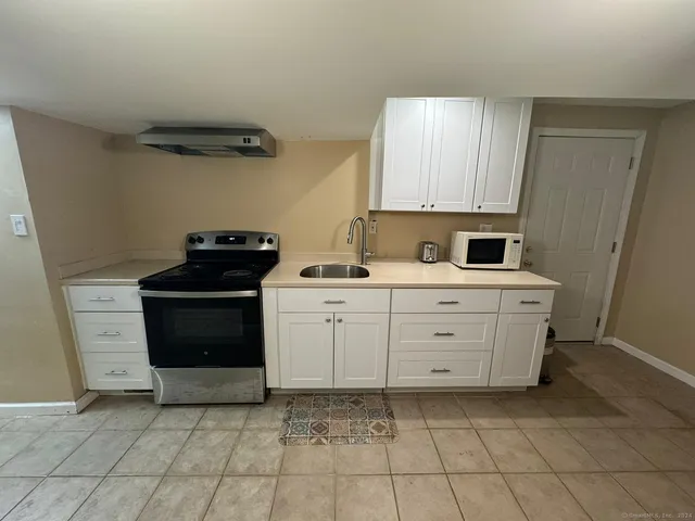 a view of a kitchen with a sink