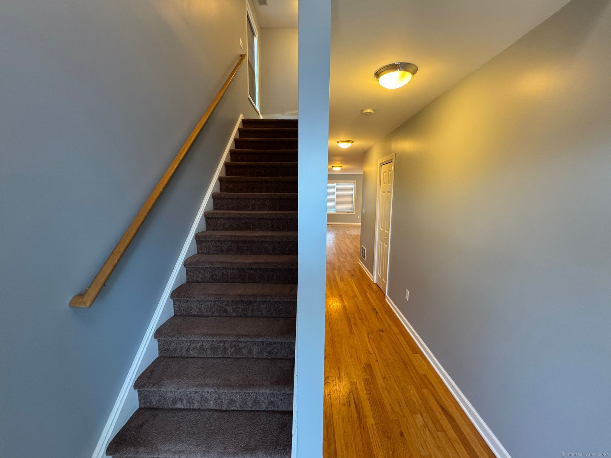 59 Gilbert Lane Branford, CT 06405 - Photo 6 of 40 a view of entryway and hall with wooden floor