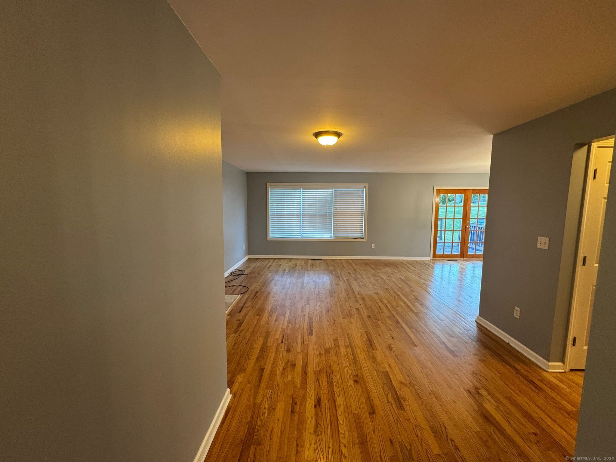 59 Gilbert Lane Branford, CT 06405 - Photo 7 of 40 wooden floor in an empty room with a window