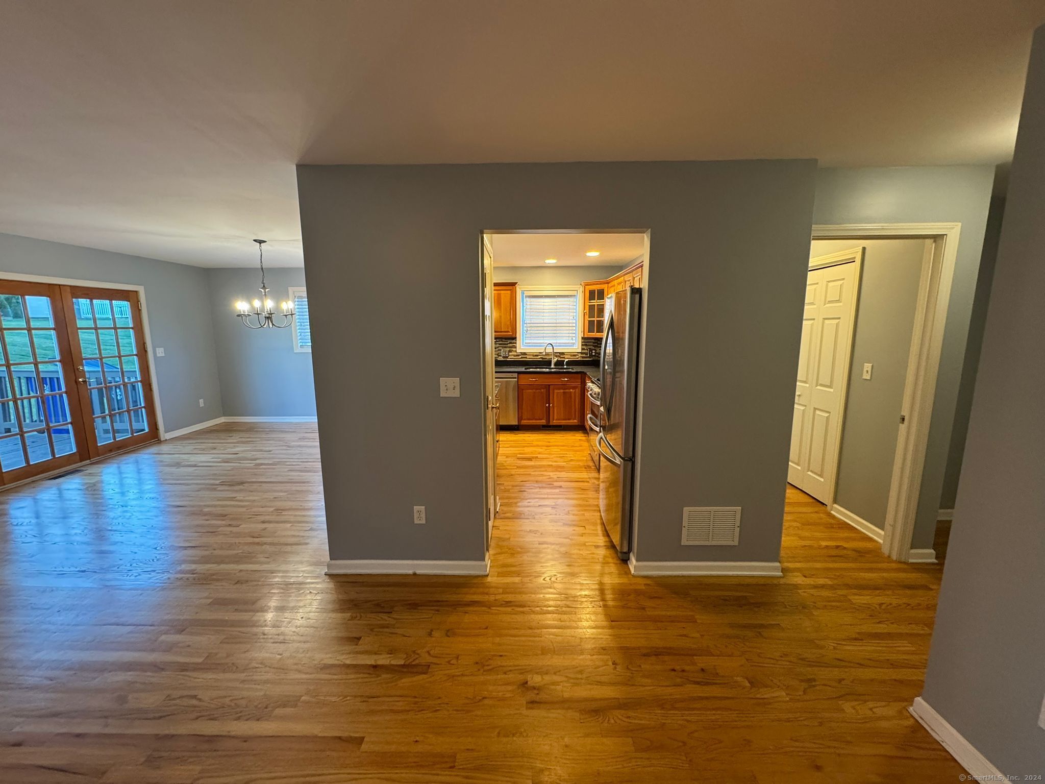 59 Gilbert Lane Branford, CT 06405 - Photo 8 of 40 a view of a hallway with wooden floor
