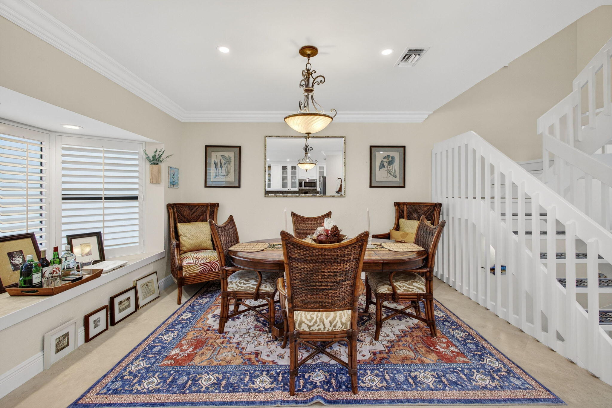 170 Celestial Way, Unit 35 Juno Beach, FL 33408 - Photo 14 of 53 a dining room with furniture a rug and wooden floor