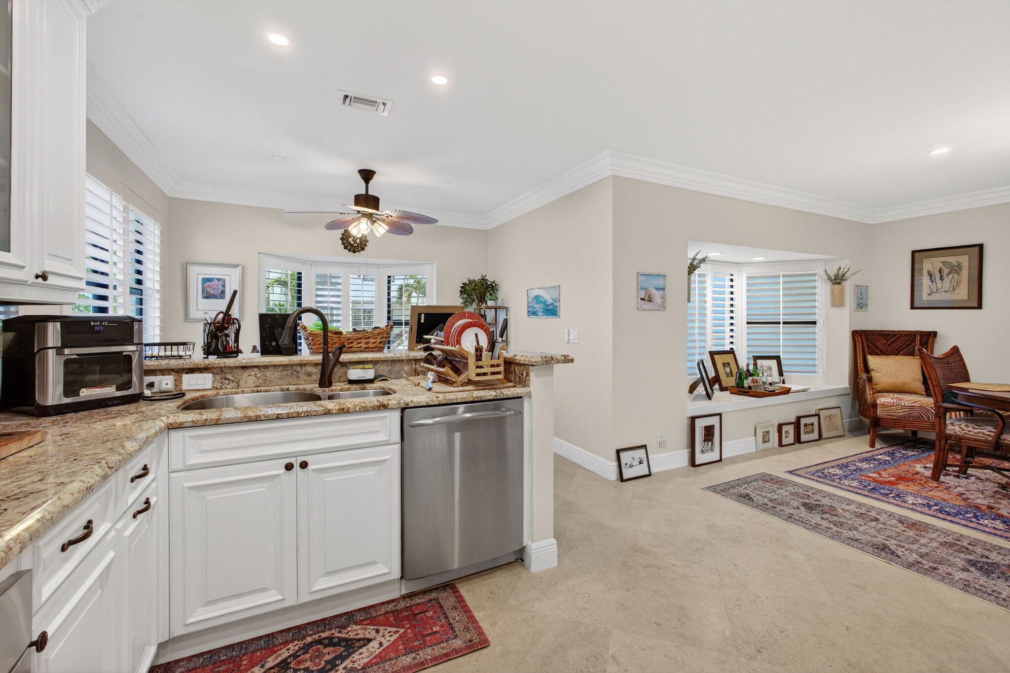 170 Celestial Way, Unit 35 Juno Beach, FL 33408 - Photo 21 of 53 a very nice looking living room with stainless steel appliances granite countertop furniture and a kitchen view
