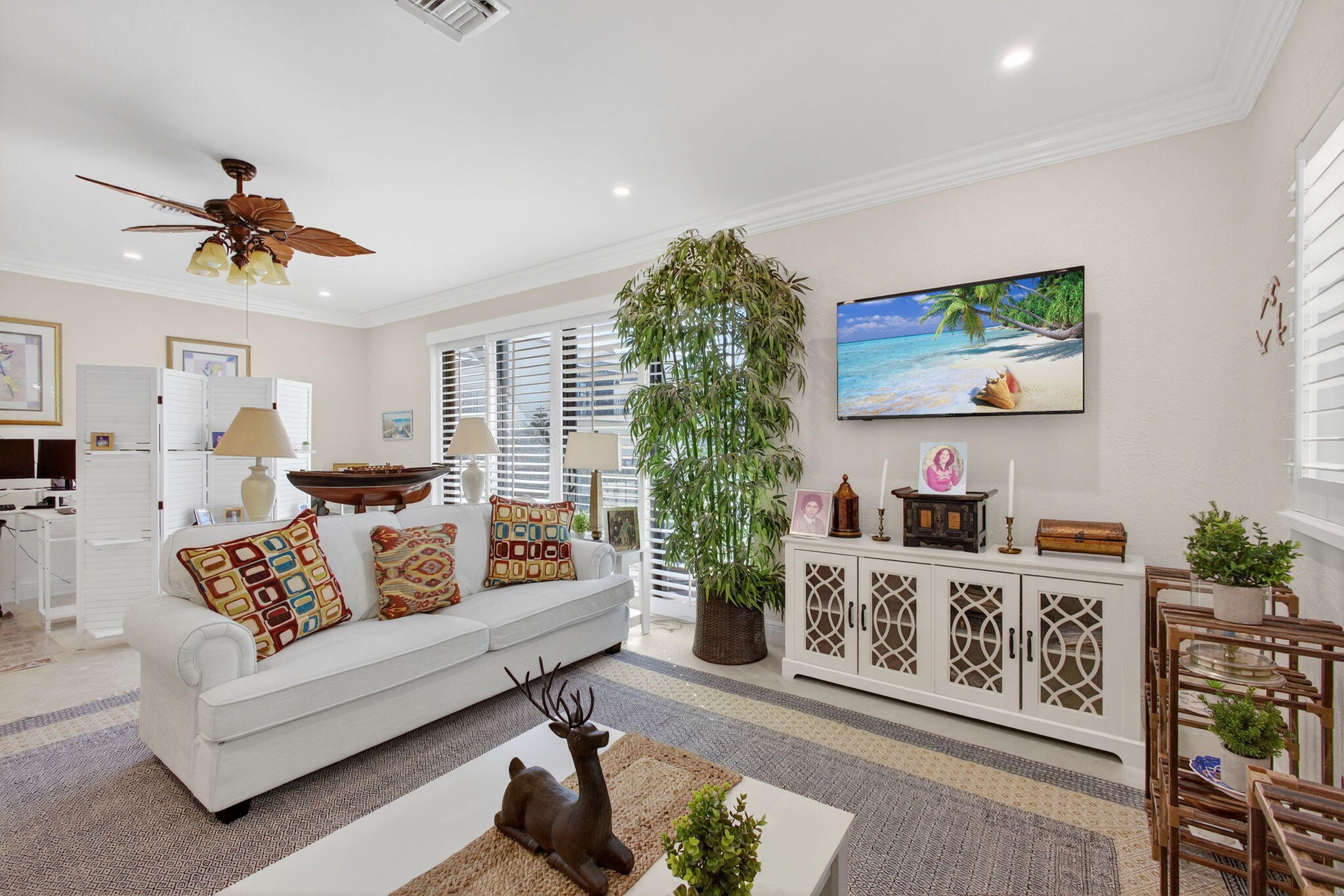 170 Celestial Way, Unit 35 Juno Beach, FL 33408 - Photo 25 of 53 a living room with furniture and a flat screen tv