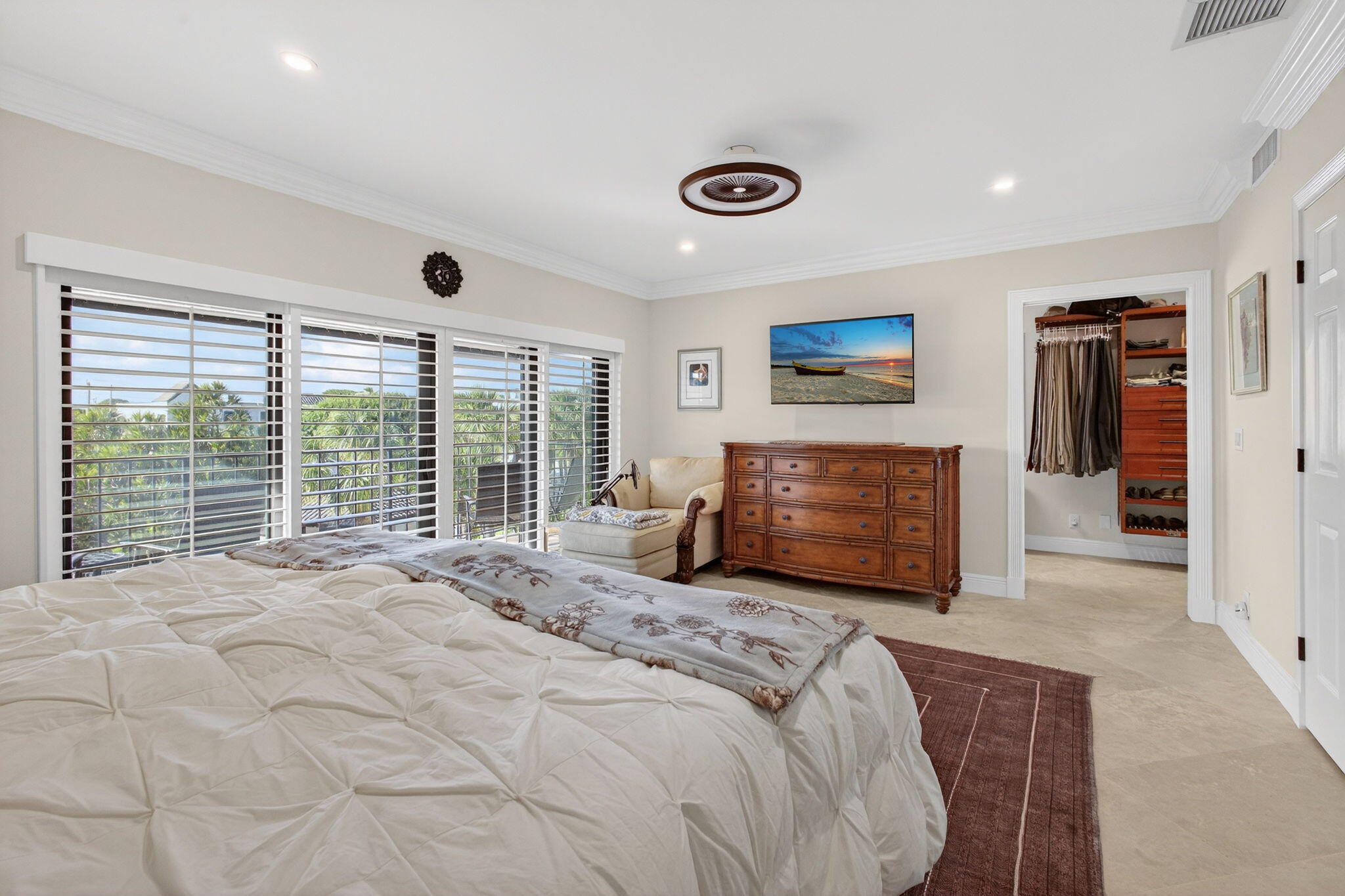 170 Celestial Way, Unit 35 Juno Beach, FL 33408 - Photo 33 of 53 a bed room with a bed and a television