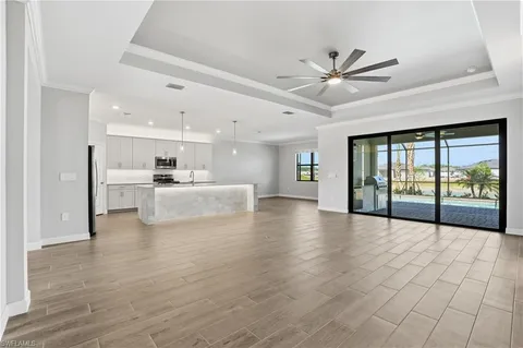 a view of a kitchen with a sink and a window