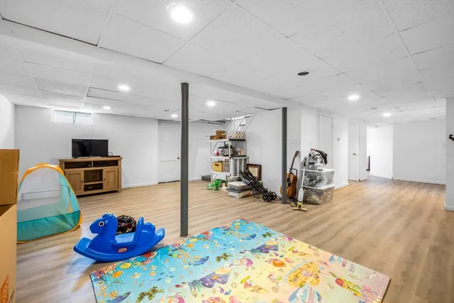 a living room with furniture kitchen and a table