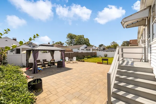 a view of a swimming pool with a lounge chair