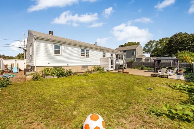 a house view with swimming pool and sitting space