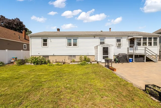 a front view of house with yard and swimming pool