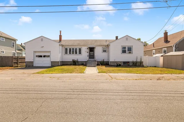 a view of the house with a swimming pool