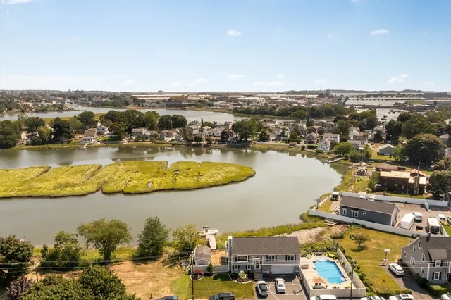 an aerial view of residential houses with outdoor space