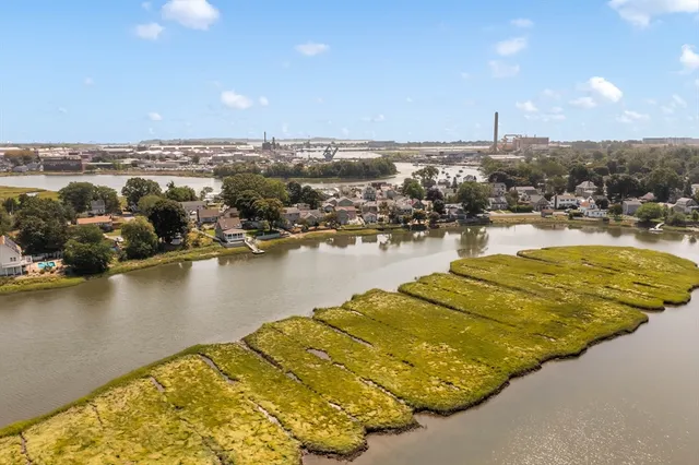 an aerial view of residential houses with outdoor space