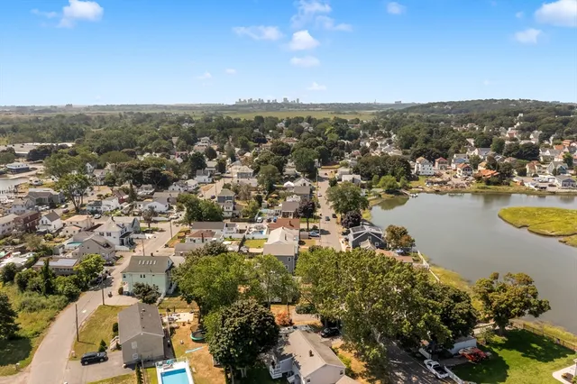 an aerial view of residential houses with outdoor space