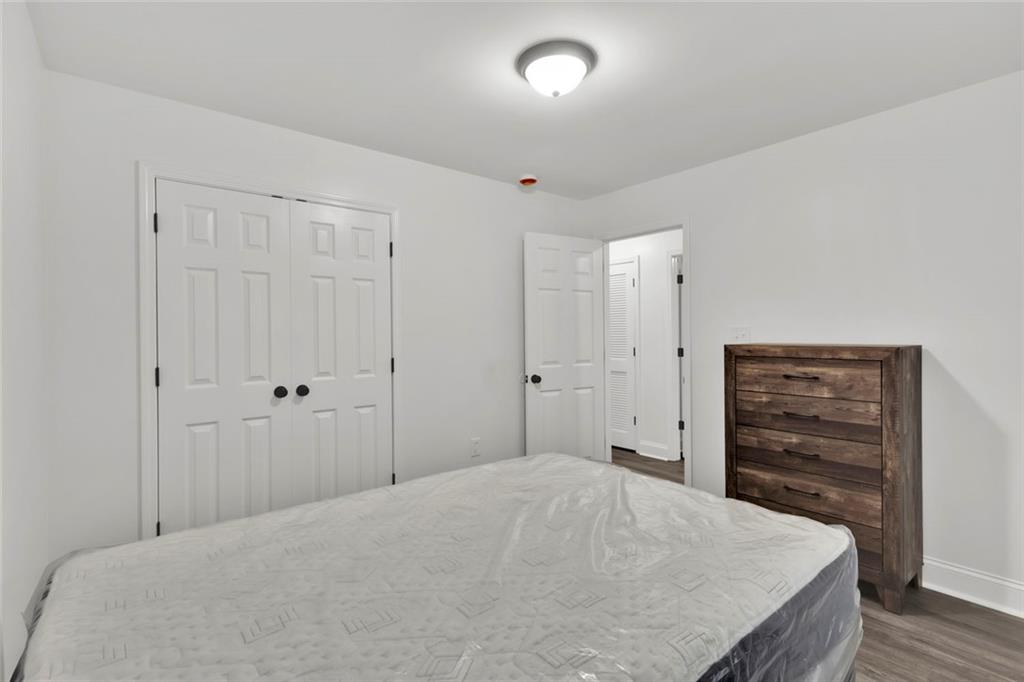 614 Elberta Street Fort Valley, GA 31030 - Photo 16 of 31 a bedroom with a bed and a closet