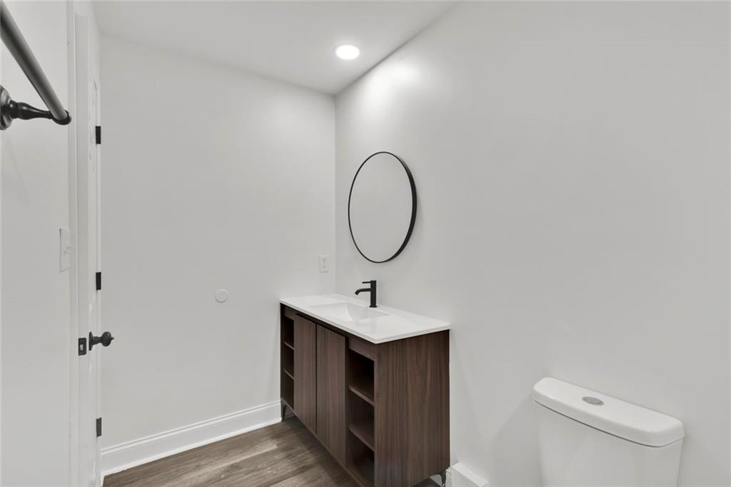 614 Elberta Street Fort Valley, GA 31030 - Photo 23 of 31 a bathroom with a sink vanity and a mirror