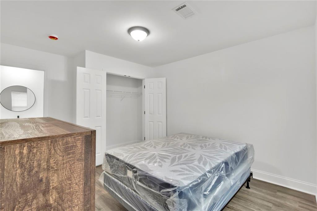614 Elberta Street Fort Valley, GA 31030 - Photo 25 of 31 a living room with a stove and a table