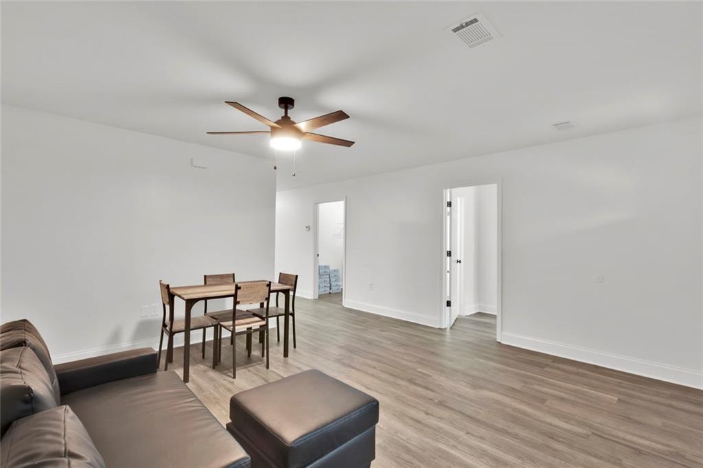 614 Elberta Street Fort Valley, GA 31030 - Photo 28 of 31 a view of a livingroom with furniture and wooden floor