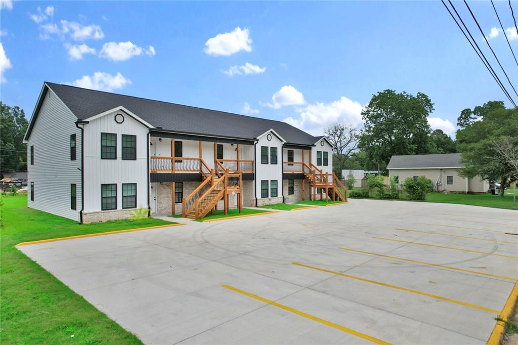 614 Elberta Street Fort Valley, GA 31030 - Photo 3 of 31 a front view of a house with a yard and garage