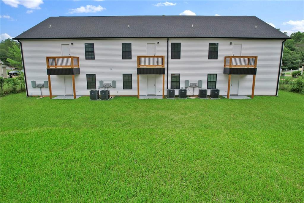 614 Elberta Street Fort Valley, GA 31030 - Photo 5 of 31 a front view of a house with a garden