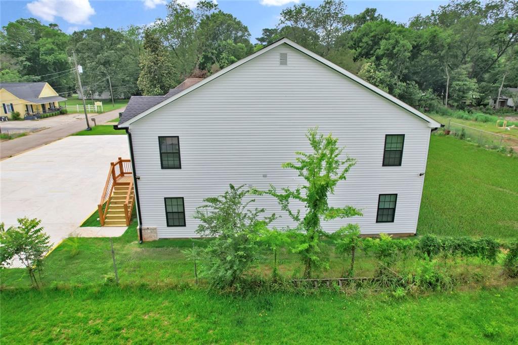 614 Elberta Street Fort Valley, GA 31030 - Photo 7 of 31 a house that has a tree in front of it