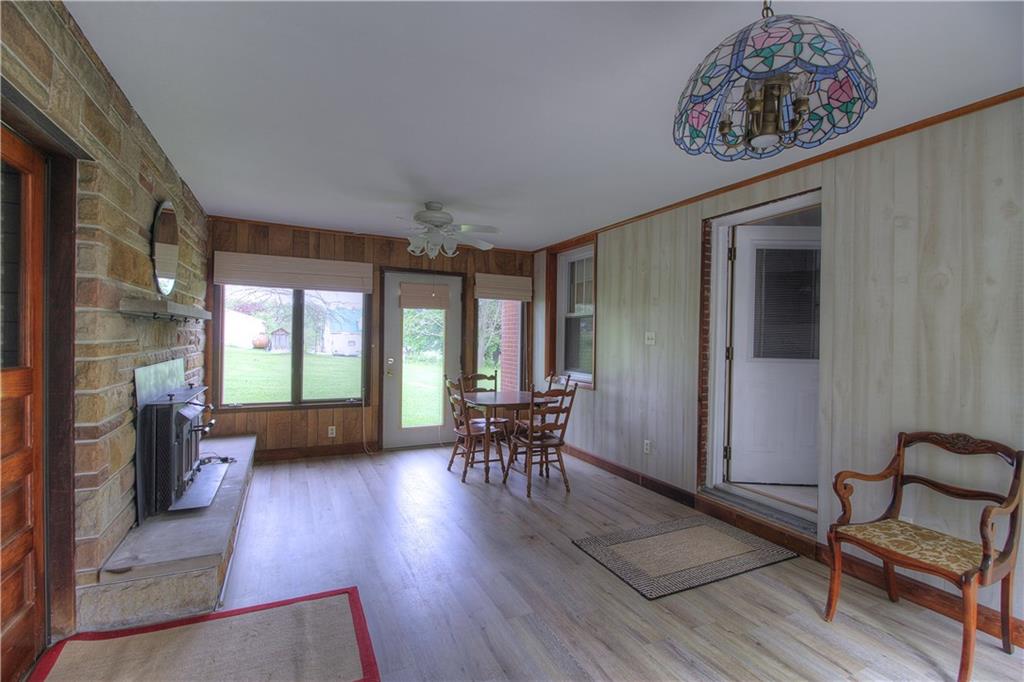 6414 Tuscarawas Road Midland, PA 15059 - Photo 5 of 24 BREEZEWAY WITH WOOD/GAS FIREPLACE