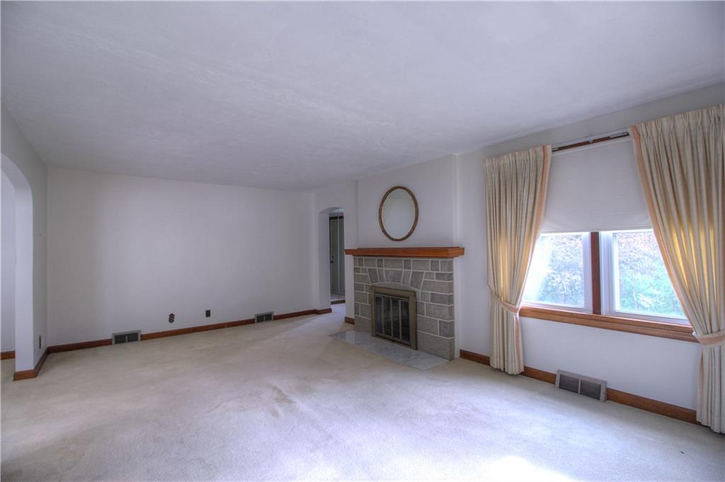 6414 Tuscarawas Road Midland, PA 15059 - Photo 10 of 24 LIVING ROOM WITH WOOD BURNING FIREPLACE