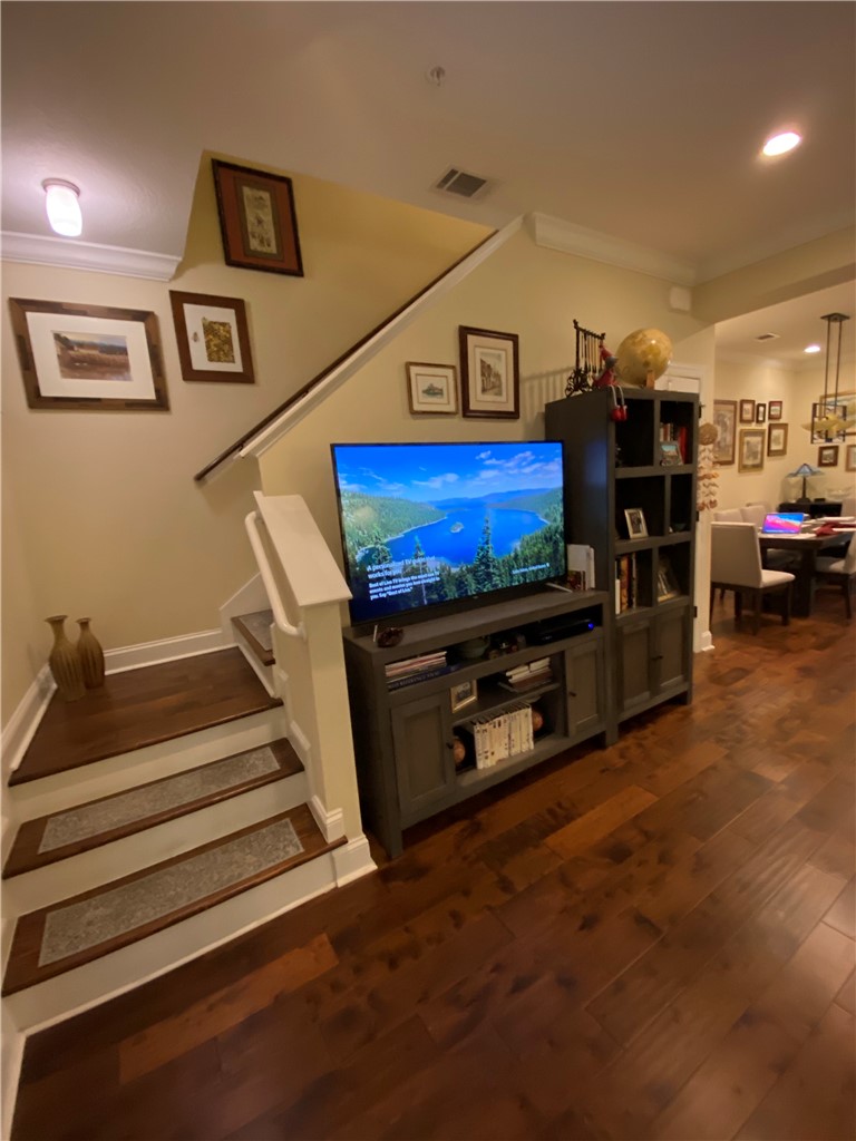 803 Reserve Lane St. Simons Island, GA 31522 - Photo 11 of 11 Stairway with wood floors throughout