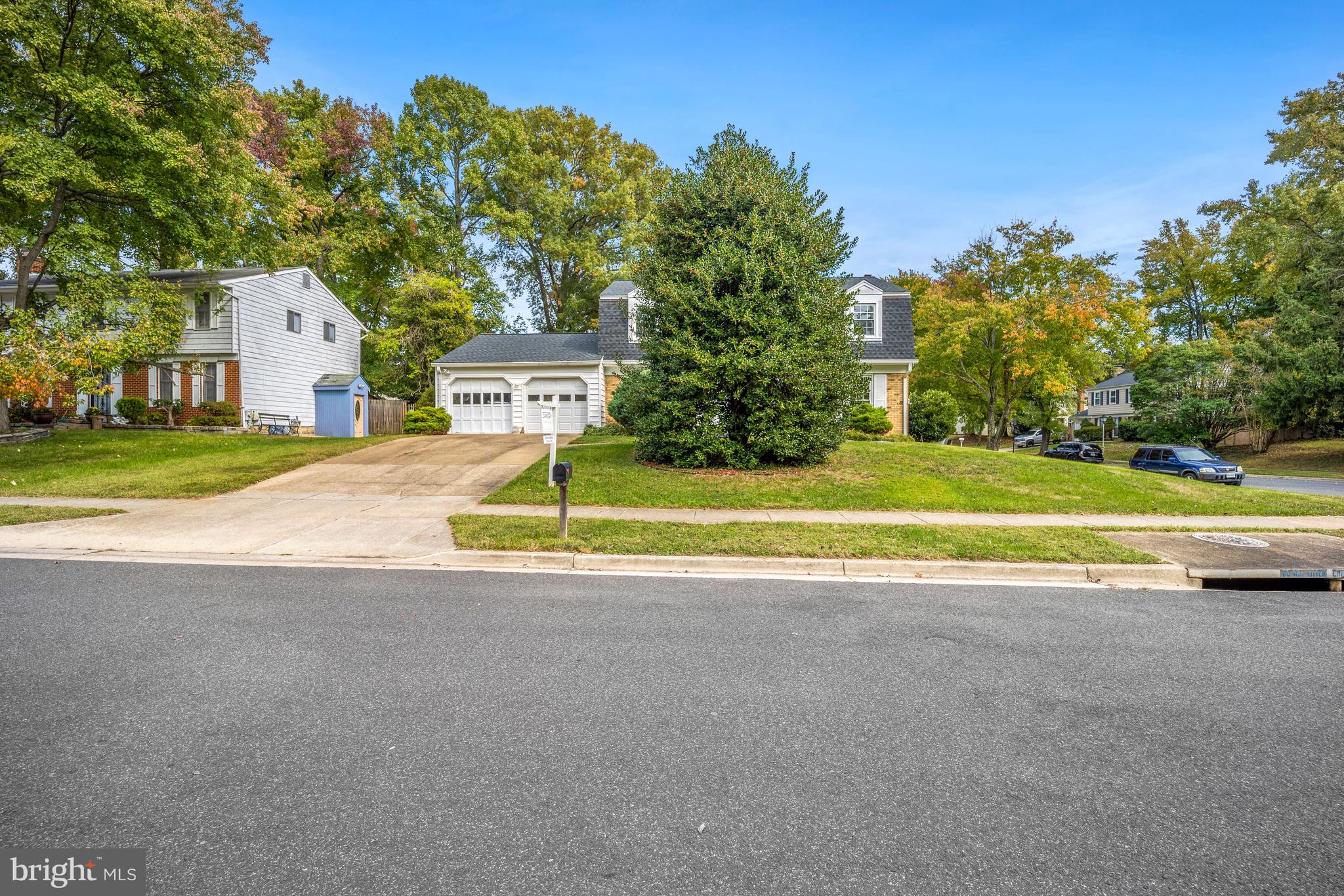Large evergreen tree in front gives privacy