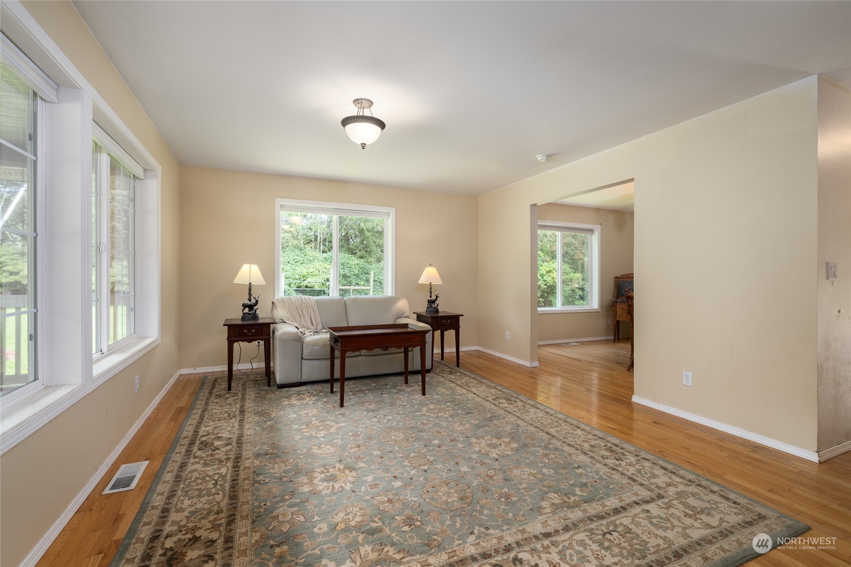 23610 Hoogdal Road Sedro-Woolley, WA 98284 - Photo 11 of 39 a living room with furniture and a window